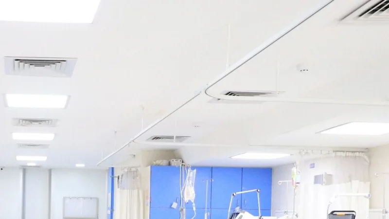 Ceiling of the intensive care unit at Jeewan Mala Hospital showing recessed light panels, air-conditioning diffusers and bed-curtain tracks